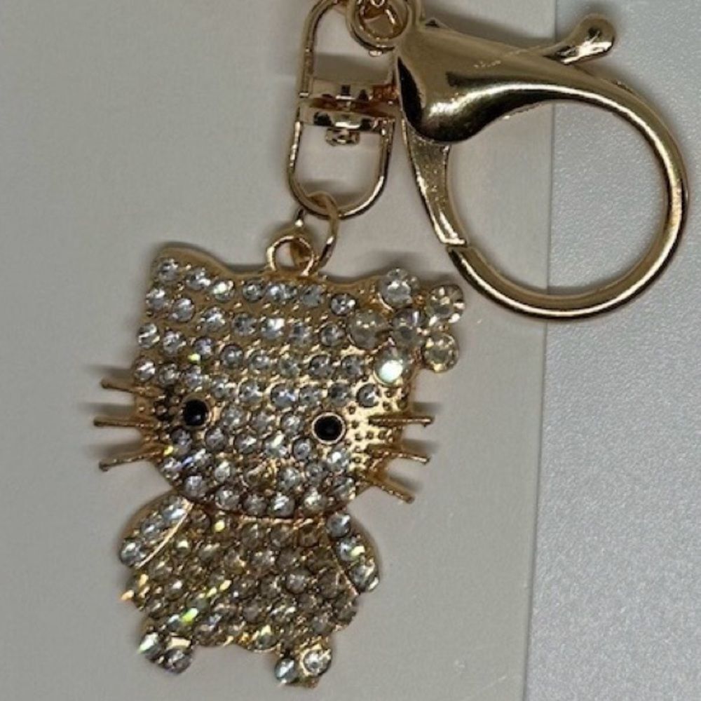BAG CHARM  Hello Kitty Gold Tone Crystal Flower Bag Charm Keychain